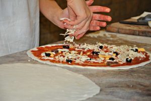 preparing pizza
